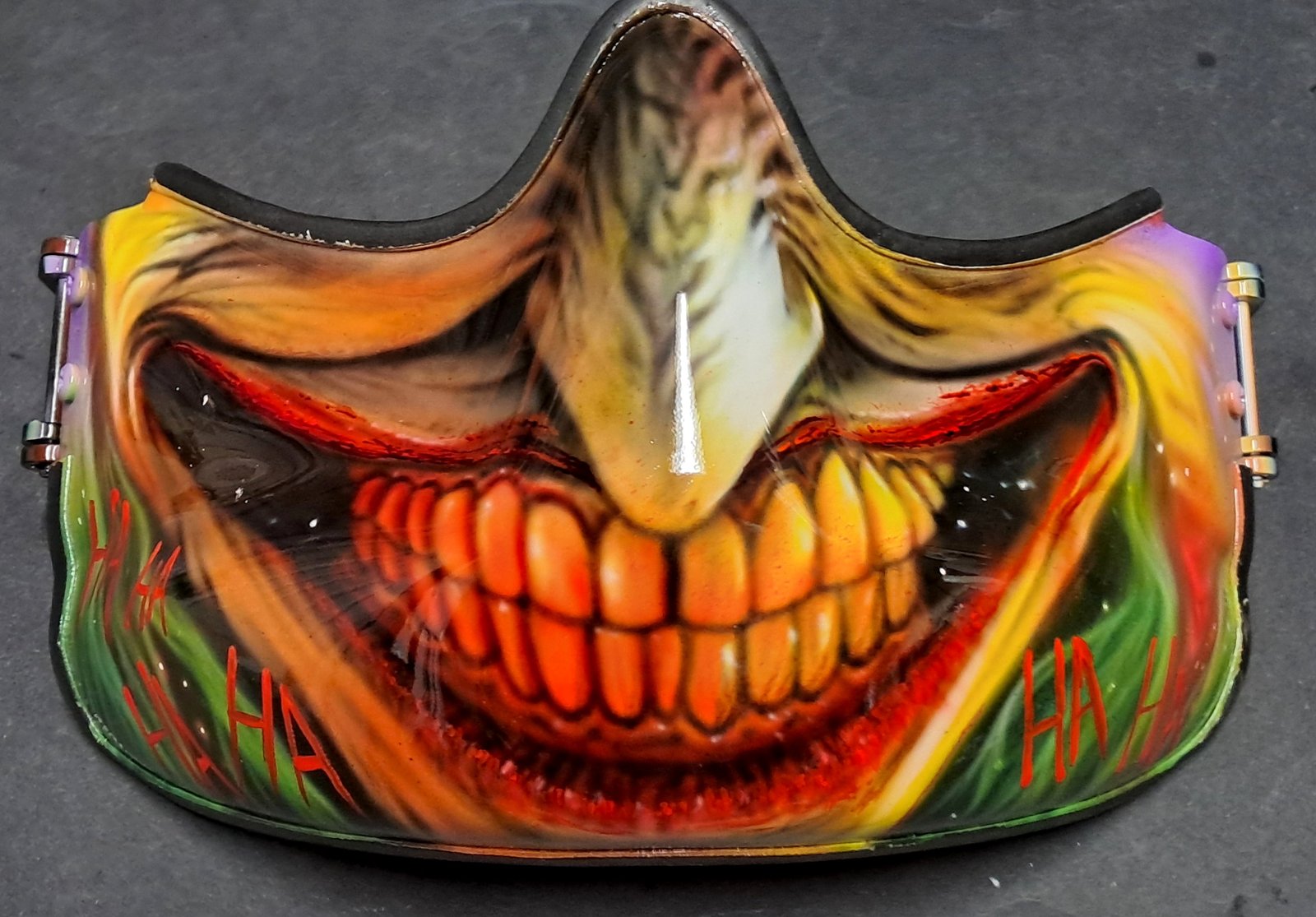 Joker laughing 'HA HA HA' horror mask.