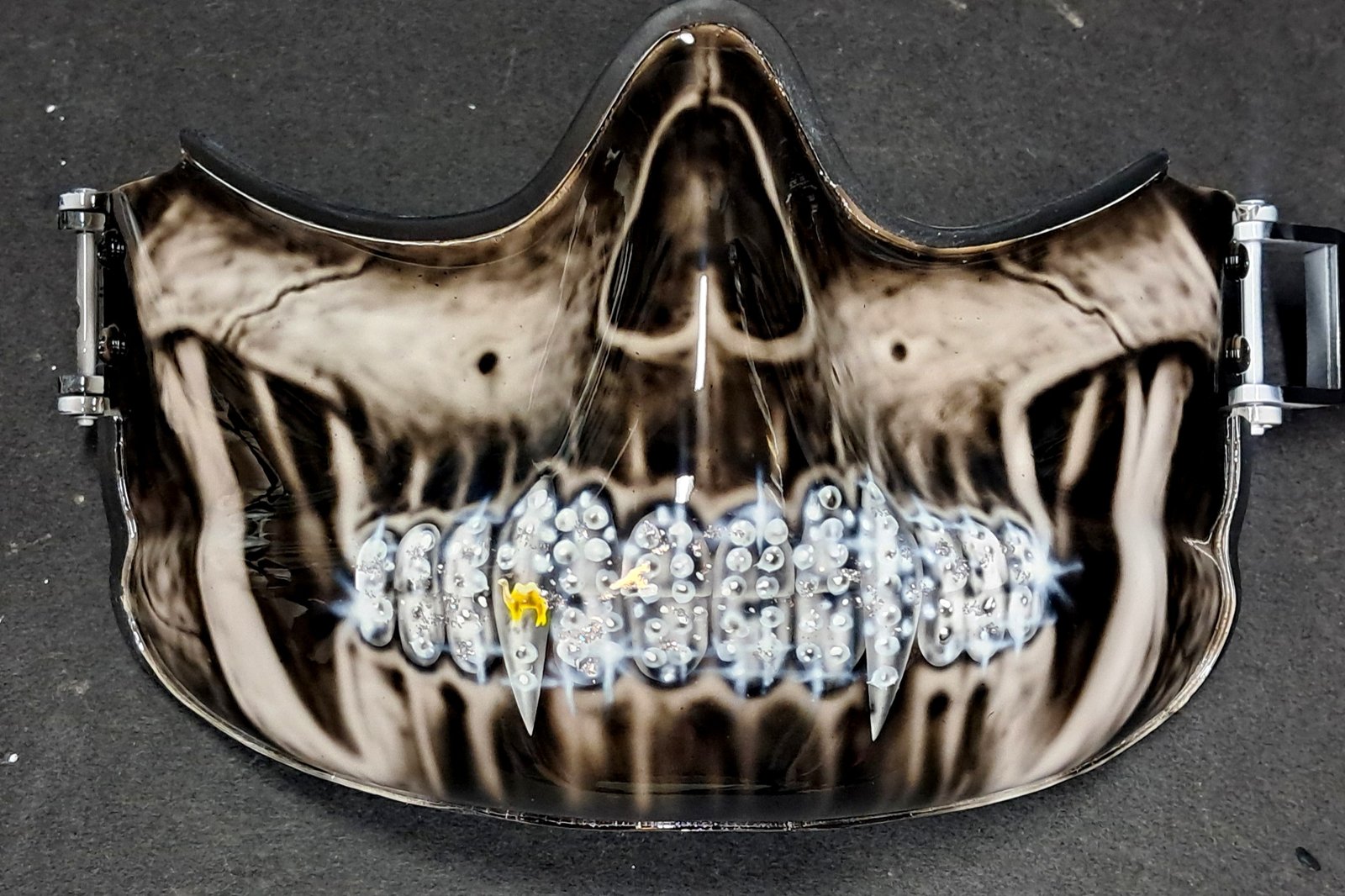 Military skeleton grill teeth close-up mask.