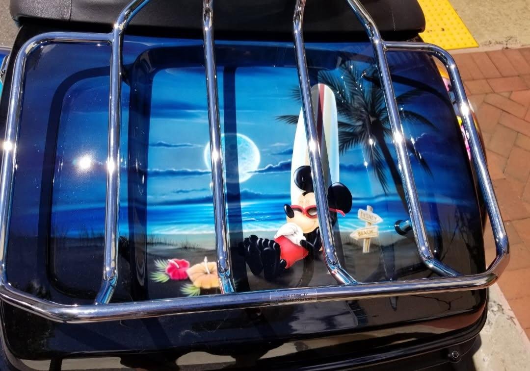 Mickey at the Beach with a Surfboard On Back of Disney Themed Motorcycle